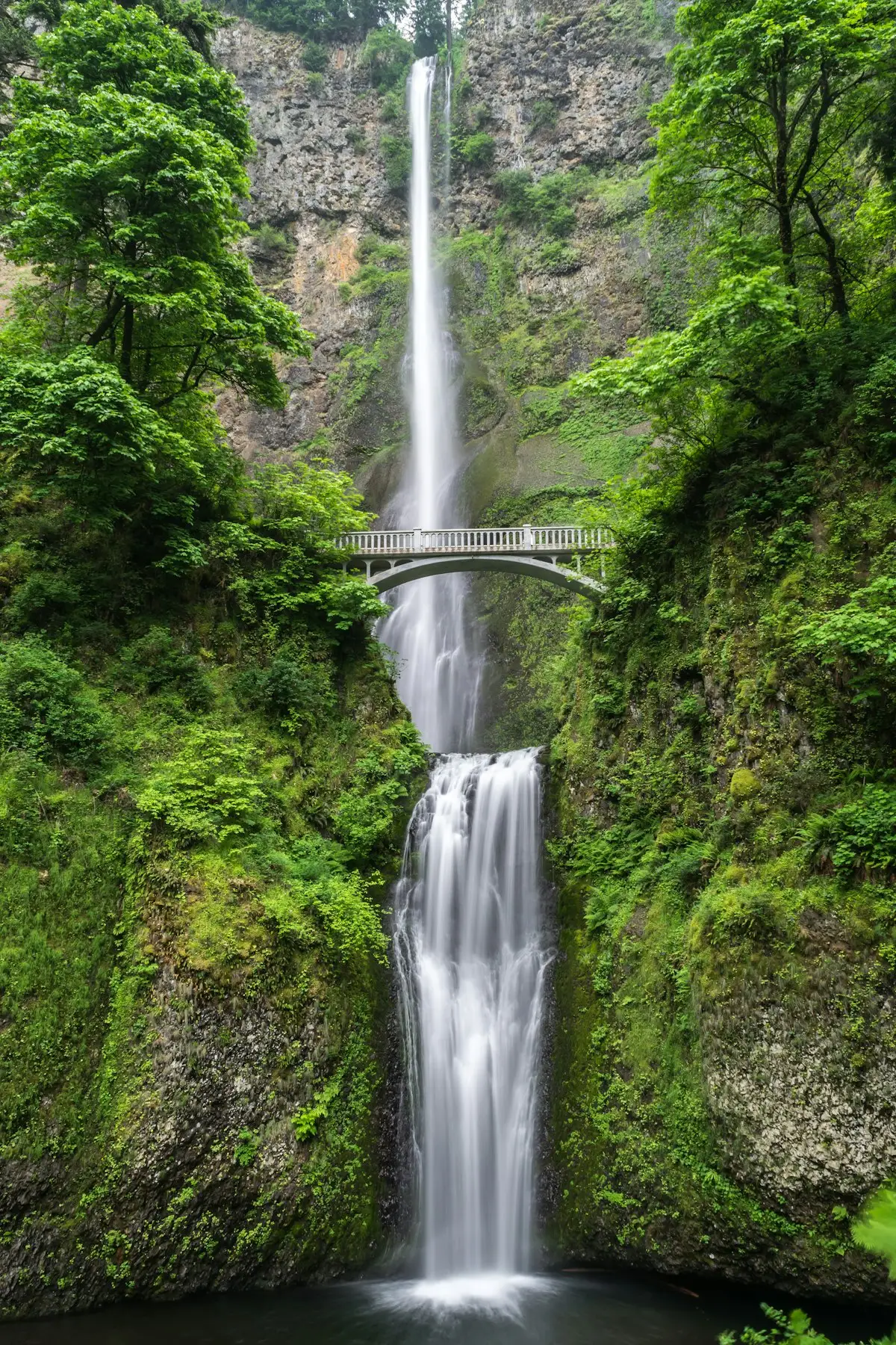 Waterfall under a footbridge